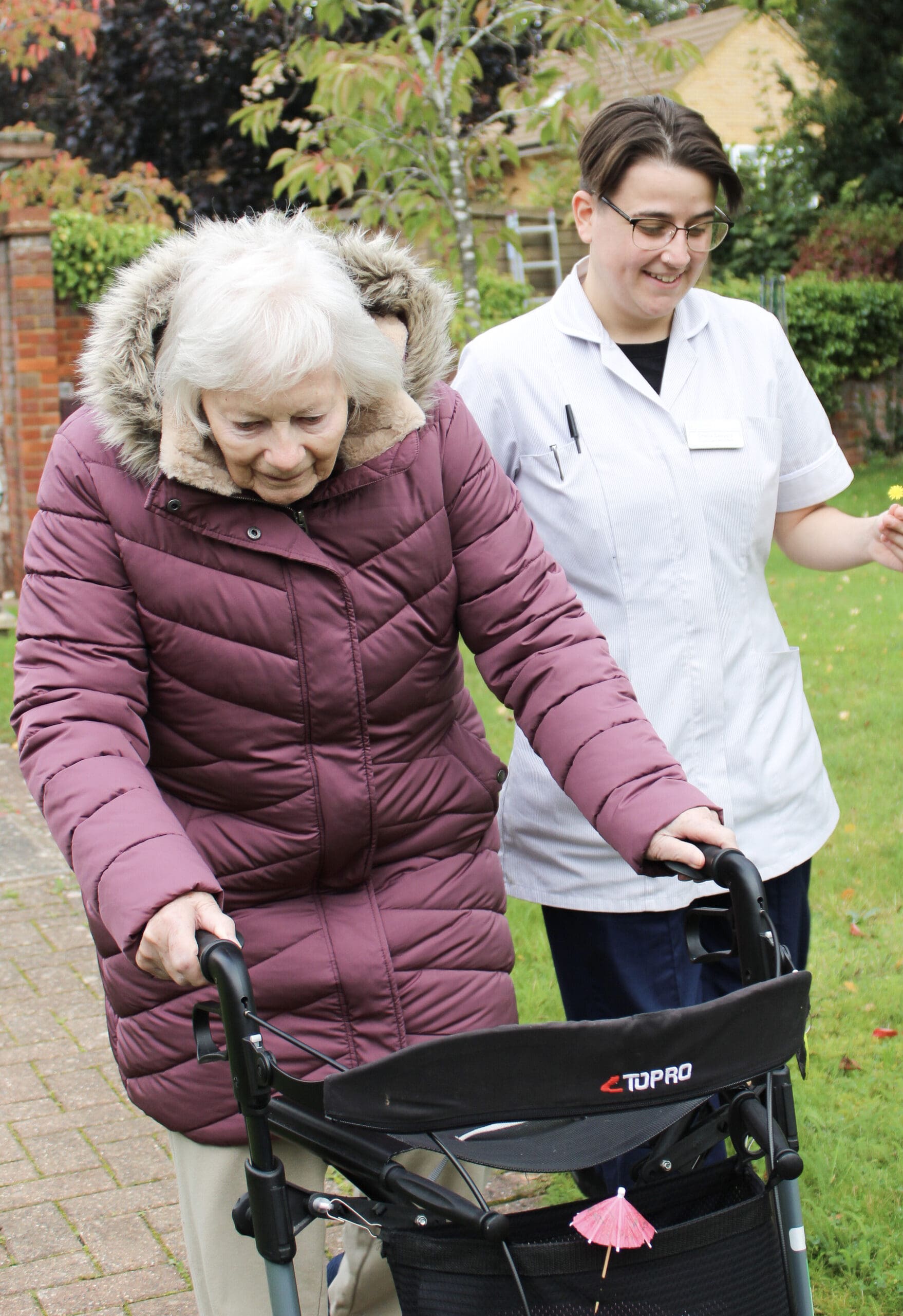 Salveo Care | One of our residents walking with on of our members of staff