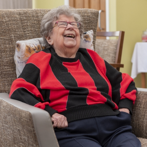 Salveo Care | One of our residents laughing and smiling