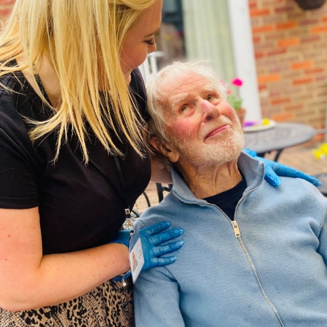 Salveo Care | one of our members of staff tending to one of our residents