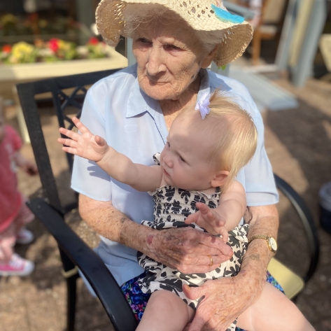 Salveo Care | One of our residents holding a younger family member