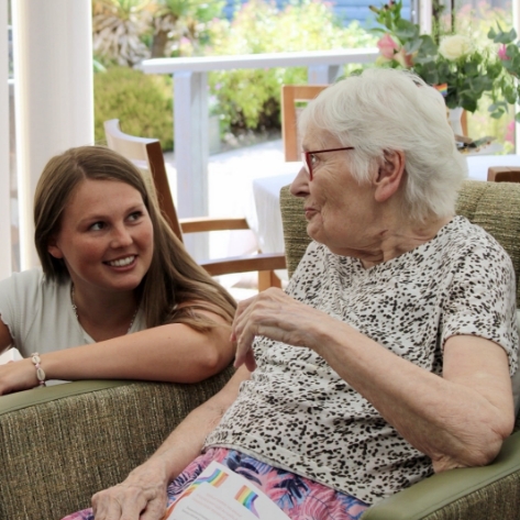 Salveo Care | An image showing one of our residents engaging with our deputy manager