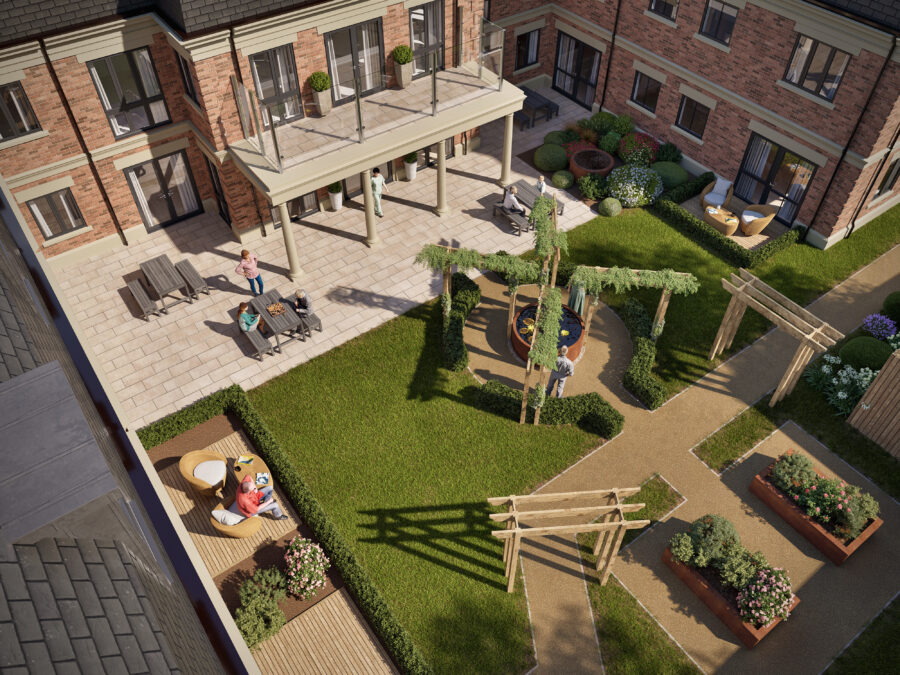 Aerial view of a landscaped courtyard with walking paths, benches, raised garden beds, patio seating, and several people relaxing and enjoying the outdoor space.