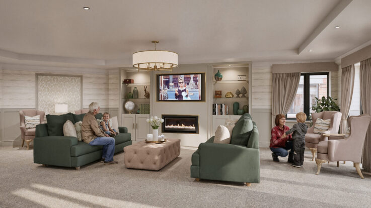 Spacious living room with people sitting on sofas and armchairs, a television above a fireplace, large windows, and neutral décor.